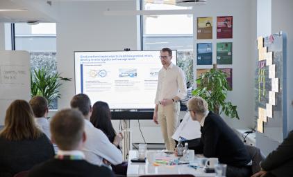 Workshop participants in circular economy workshop listening to a presentation.