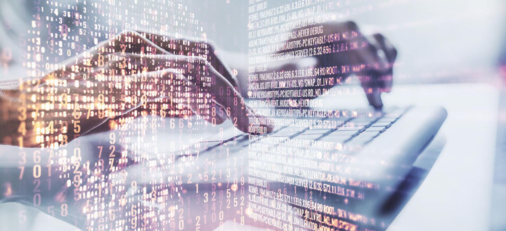 Stockpic of code and hands on keyboard