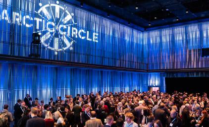 Arctic Circle Assembly Iceland reception hall full of people mingling