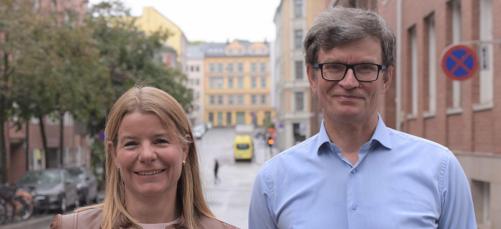Marthe Haugland and Kyösti Lempa standing outside in Oslo and smiling at the camera.