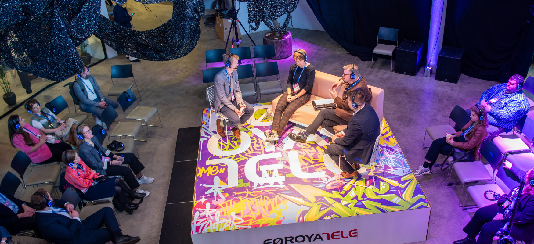 Emil on stage moderating the panel debate at Tonik