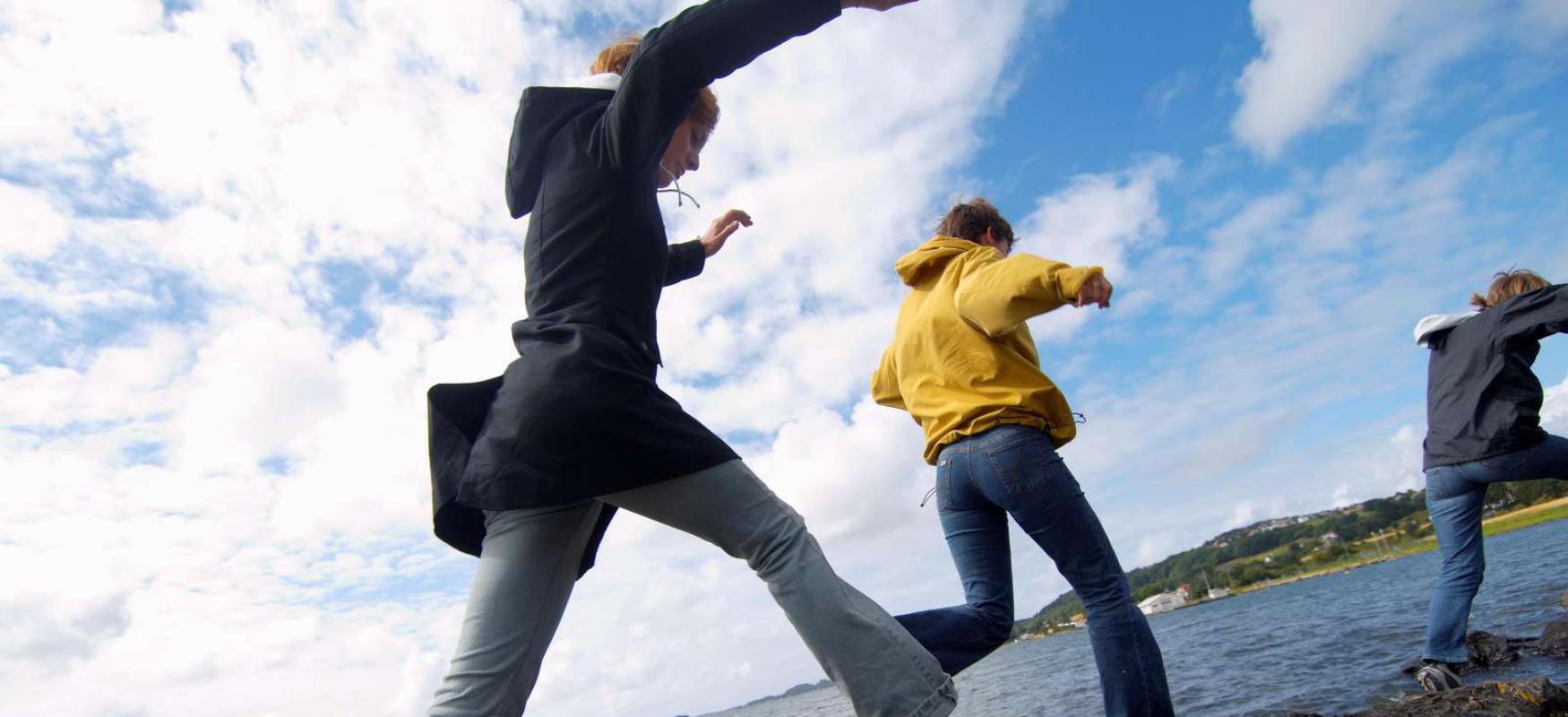 Youth running by the sea in Stavanger.
