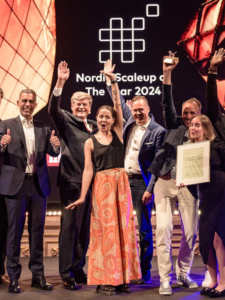 Qred winner of Nordic Scaleup Award 2024 on stage with Svein Berg, Nordic Innovation