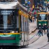 Trams and bikers in a city centrum. 