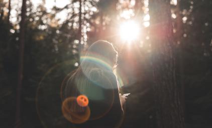 Woman in the woods with smartphone