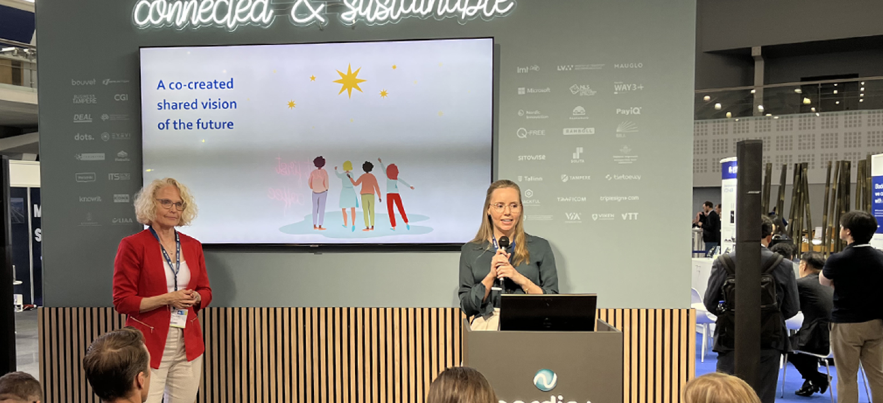 Nina and Hege holding a presentation at ITS Lisbon 2023